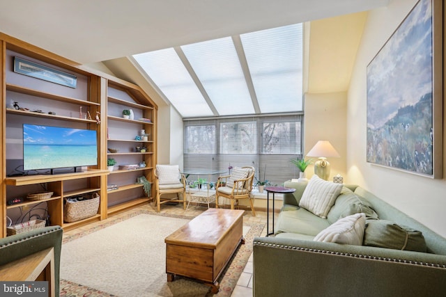 living room featuring lofted ceiling