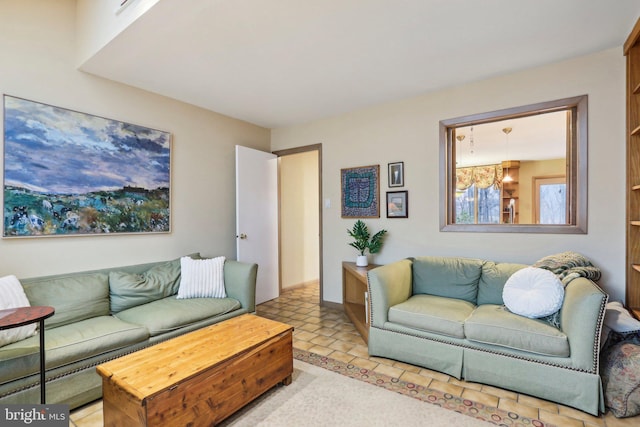 living room featuring an inviting chandelier