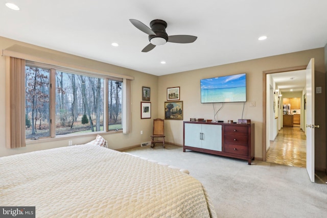 carpeted bedroom with ceiling fan