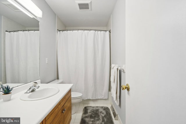 bathroom with tile patterned flooring, vanity, toilet, and a shower with shower curtain