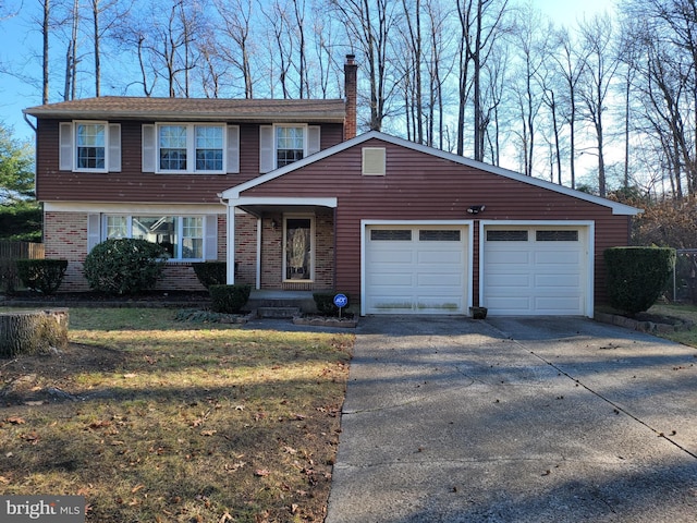 view of front facade with a front lawn and a garage