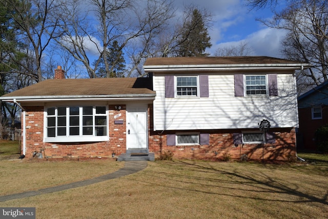 split level home with a front yard