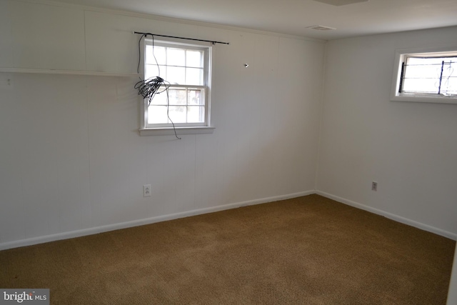 carpeted empty room with a healthy amount of sunlight