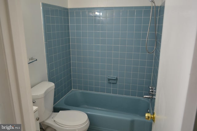 bathroom with toilet and tub / shower combination