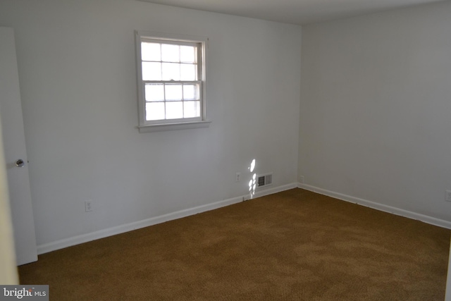 spare room with carpet floors