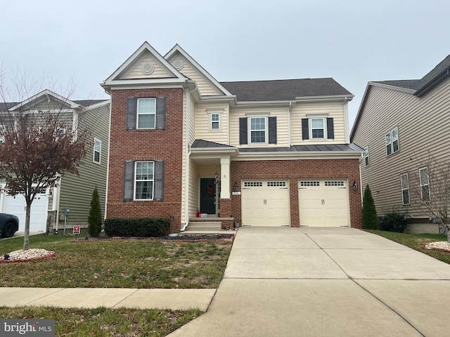 view of front of property with a front yard and a garage