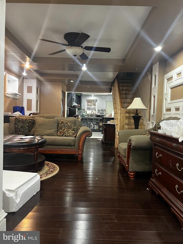 living room with hardwood / wood-style floors and ceiling fan