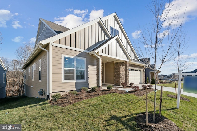 view of front of home featuring a garage and a front lawn