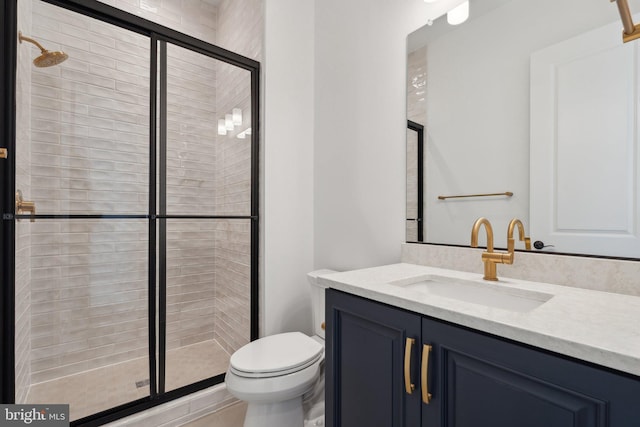 bathroom with vanity, toilet, and walk in shower