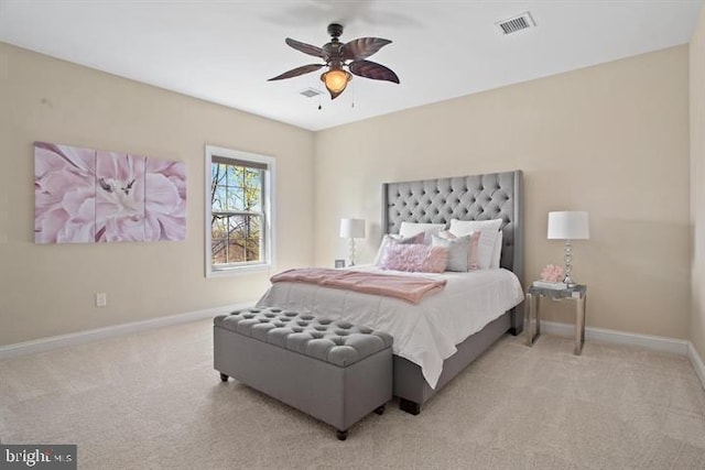 bedroom featuring ceiling fan and light carpet