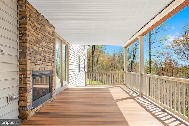 wooden terrace with a porch