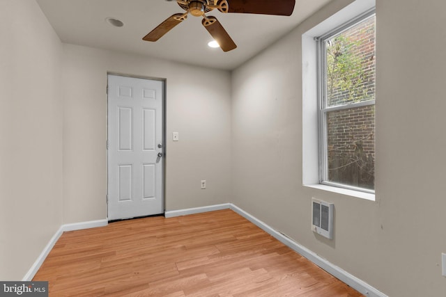 spare room featuring ceiling fan and light hardwood / wood-style floors