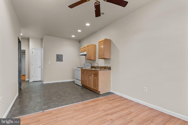 kitchen with white electric range, dark hardwood / wood-style flooring, ceiling fan, and light brown cabinetry