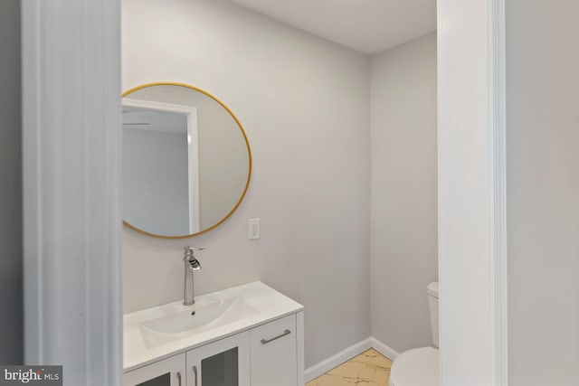 bathroom with vanity and toilet