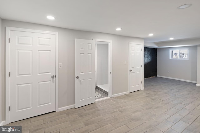 basement featuring light wood-type flooring