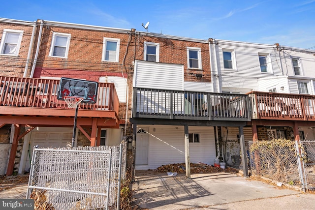 back of property with a wooden deck