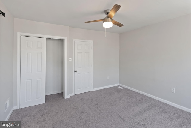 unfurnished bedroom featuring carpet flooring and ceiling fan