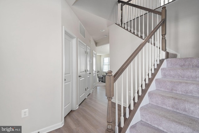 stairs with wood-type flooring