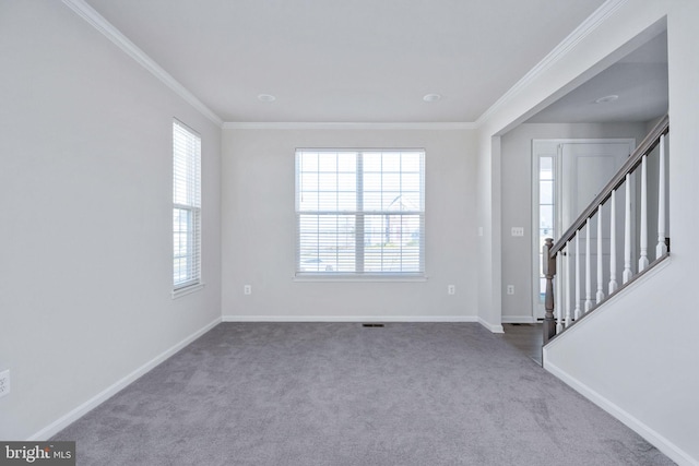 interior space with crown molding and light carpet