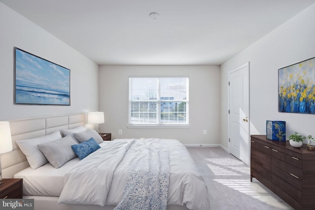 bedroom featuring light carpet