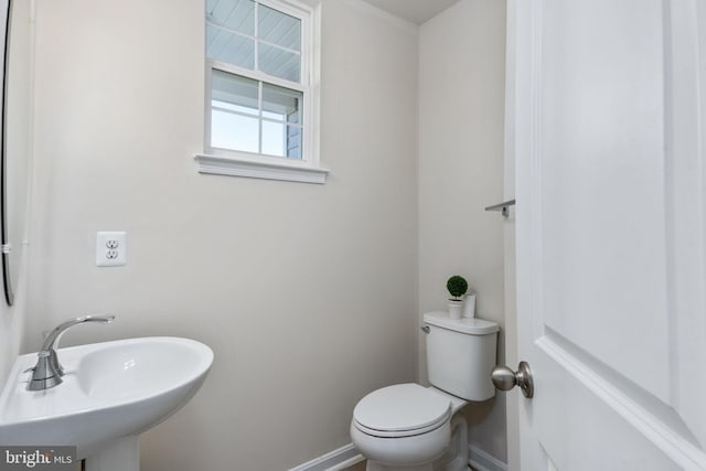 bathroom with toilet and sink