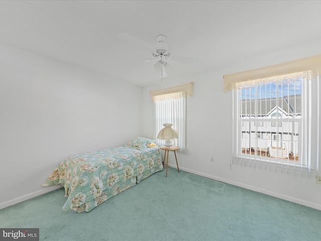 carpeted bedroom with ceiling fan