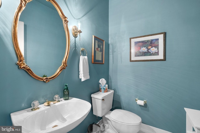 bathroom featuring sink and toilet