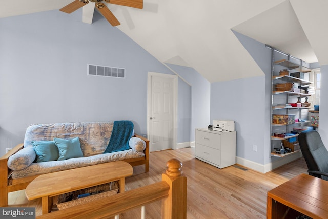 sitting room with ceiling fan, lofted ceiling, and light hardwood / wood-style floors