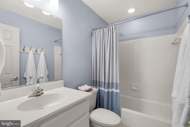 full bathroom featuring vanity, shower / bathtub combination with curtain, and toilet