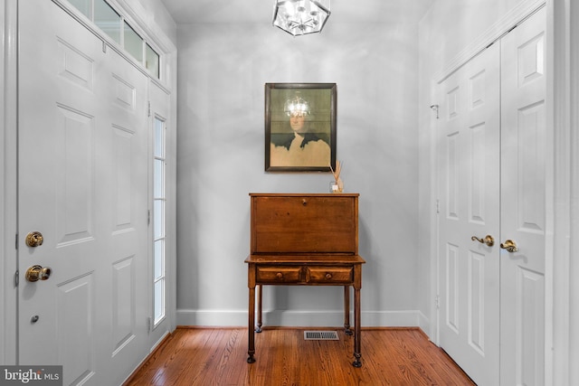 foyer entrance featuring hardwood / wood-style floors