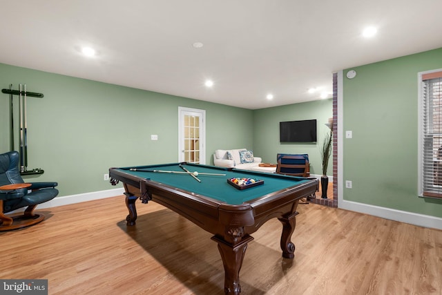 rec room with pool table and light hardwood / wood-style floors