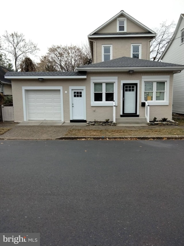 445 Magnolia St, Beverly, NJ 08010 - traditional-style home with an attached garage, brick siding, driveway, and a shingled roof