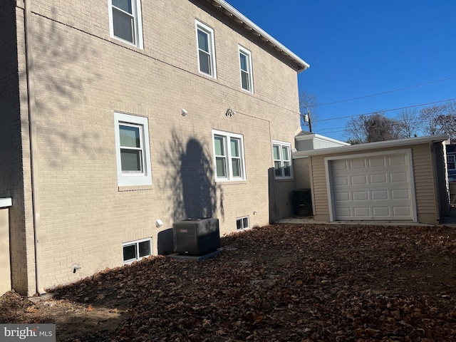 445 Magnolia St, Beverly, NJ 08010 - view of side of property featuring brick siding and an outbuilding