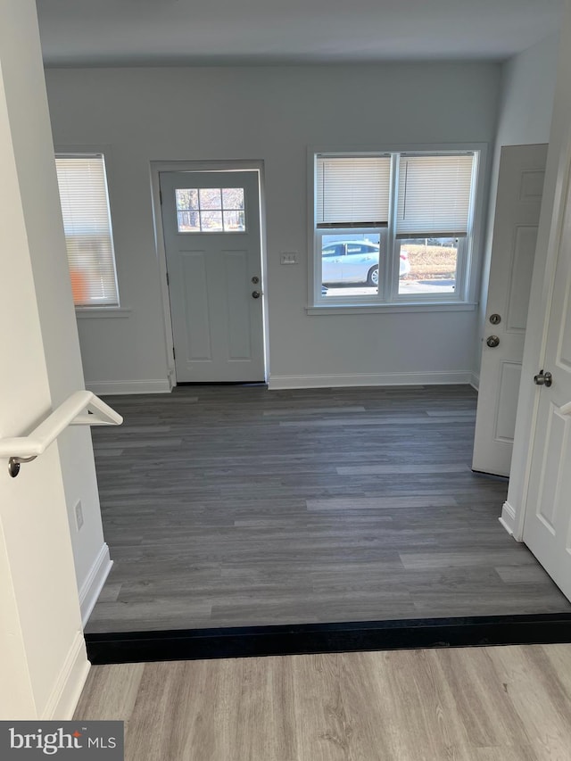 entryway with dark hardwood / wood-style floors