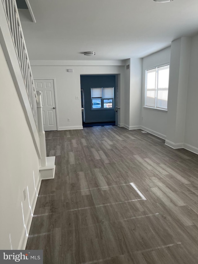 445 Magnolia St, Beverly, NJ 08010 - unfurnished living room with dark wood-type flooring and stairs