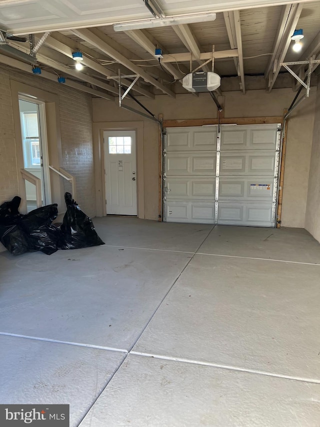 garage featuring a garage door opener