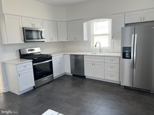 445 Magnolia St, Beverly, NJ 08010 - kitchen with stainless steel appliances, white cabinetry, and light countertops