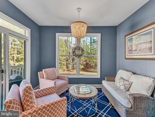 living area featuring a notable chandelier