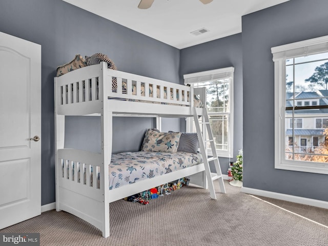 carpeted bedroom with ceiling fan