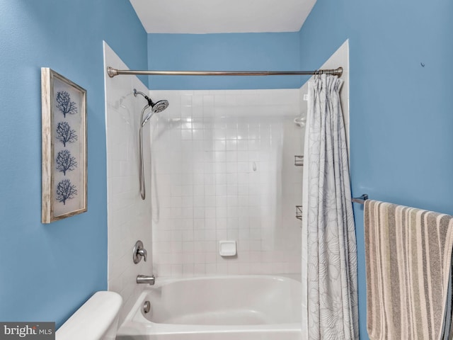 bathroom featuring shower / bathtub combination with curtain