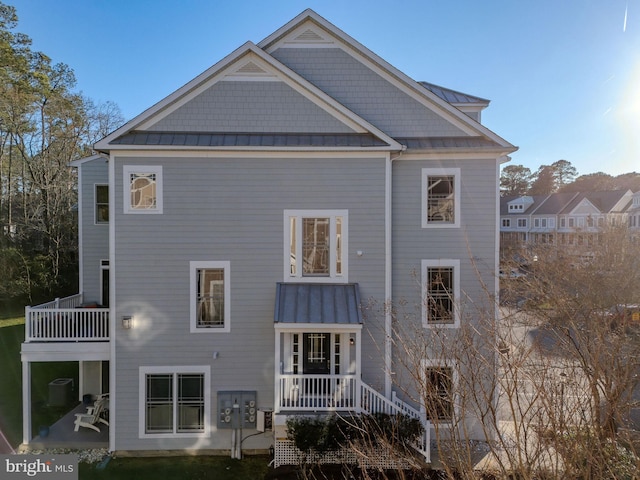 rear view of house featuring a balcony