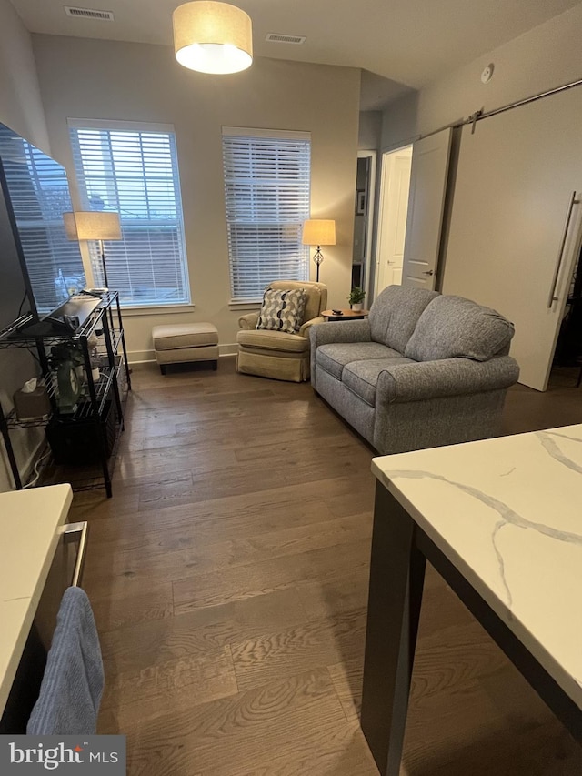 living room with dark hardwood / wood-style flooring