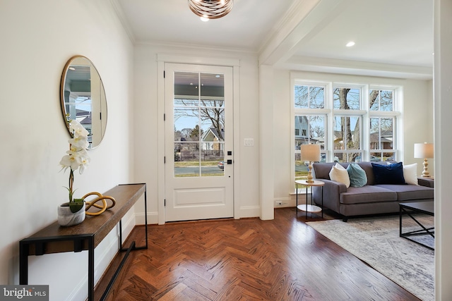 entryway with crown molding, recessed lighting, plenty of natural light, and baseboards