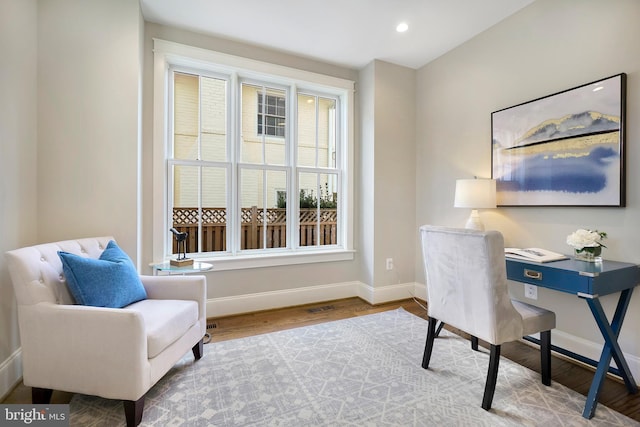 office space with baseboards, wood finished floors, and recessed lighting