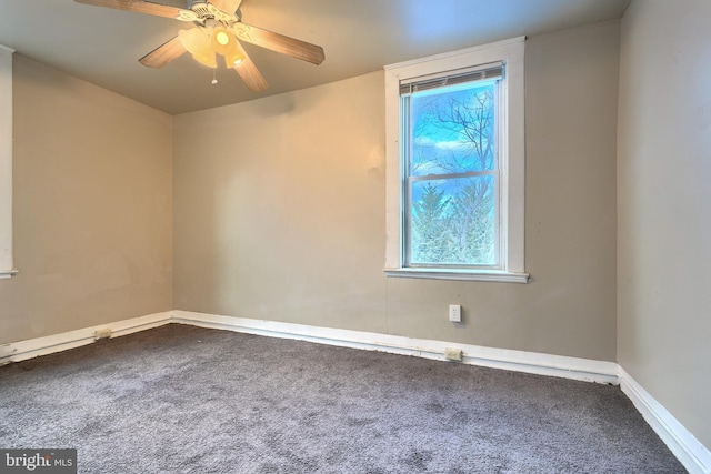 carpeted empty room with ceiling fan