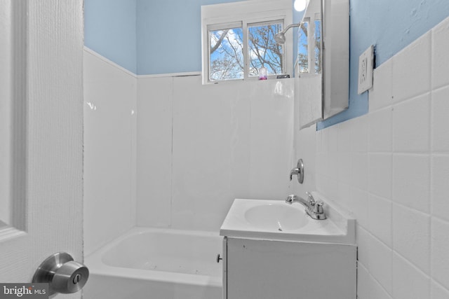 bathroom featuring vanity and shower / tub combination