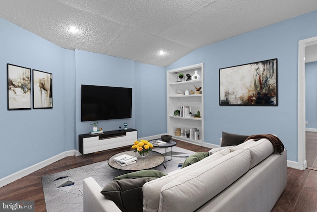 living room with a textured ceiling, dark wood-type flooring, and vaulted ceiling