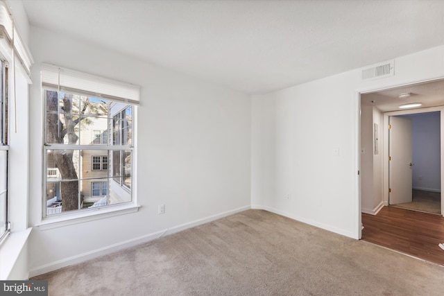 spare room with light colored carpet