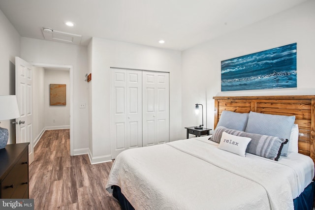 bedroom featuring hardwood / wood-style flooring and a closet