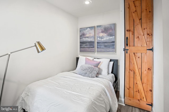 bedroom featuring hardwood / wood-style flooring